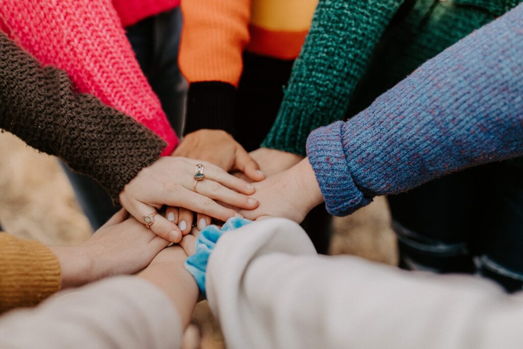 Group of women with hands together in a circle